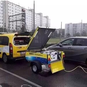 So here we have a diesel van with a petrol generator charging an electric car.jpg