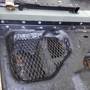Rusted hole below tank repair.jpg